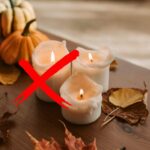 sfondo candele accese su tavolo e X rossa