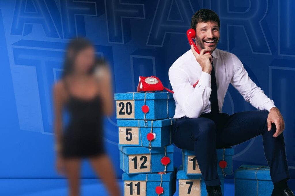 stefano de martino locandina affari tuoi e gilda ambrosio sfocata